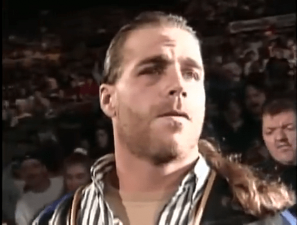 Shawn Michaels in 1995 Shawn Michaels in 1995 in an arena wearing street clothes with his long hair in a pony tail