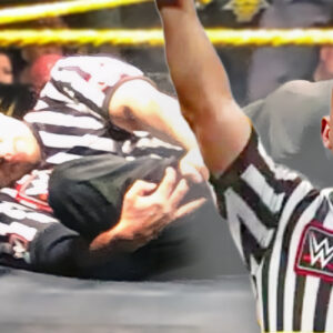 Tom Castor clutches his leg after sustaining a horrific injury while referring in the main event of a WWE NXT house show in Omaha, Nebraska, on April 25th, 2019.