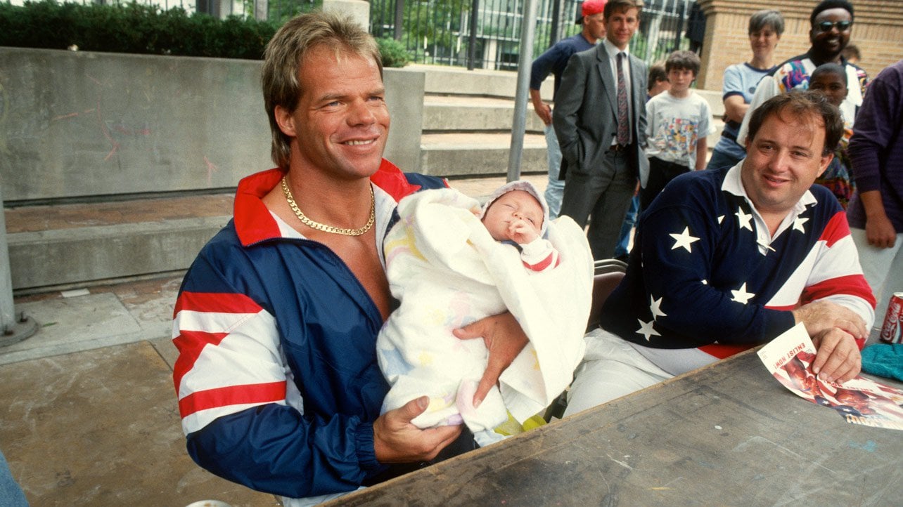 Lex Express and The Failed Lex Luger Experiment Lex Luger holding a baby during the height of the Lex Express tour, because why not?