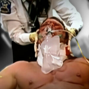 Paramedics tend to Triple H after his injury took place.