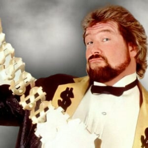 Ted DiBiase showing off his Million Dollar Championship belt. [Photo courtesy of WWE.com]