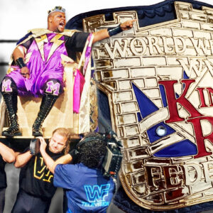 Sir Mo, alongside enhancement talent who have the unenviable task of carrying King Mabel upon his throne! After being crowned king, a King of the Ring championship belt would be commissioned, which would soon lead to controversy.