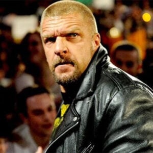 Triple H faced 4 injuries throughout his career, each nearly career-ending. Discover how he persevered through each career-defining ordeal.