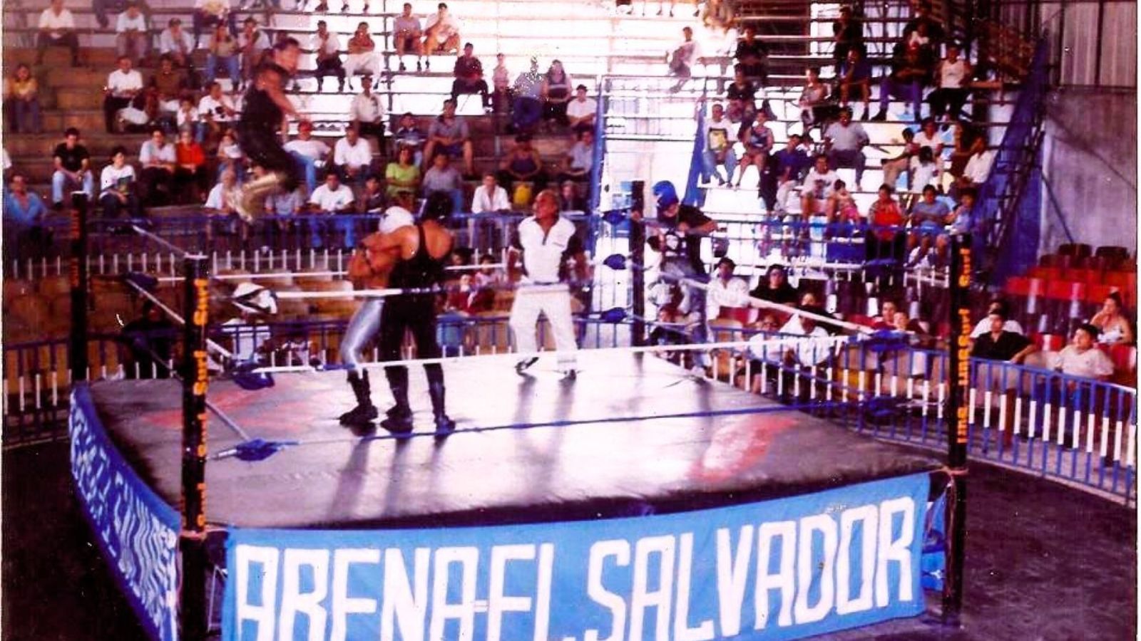 Former El Salvador wrestling arena that hosted legendary lucha libre matches, closed in 2009, now Super Repuestos auto parts store - a symbol of wrestling’s decline. 