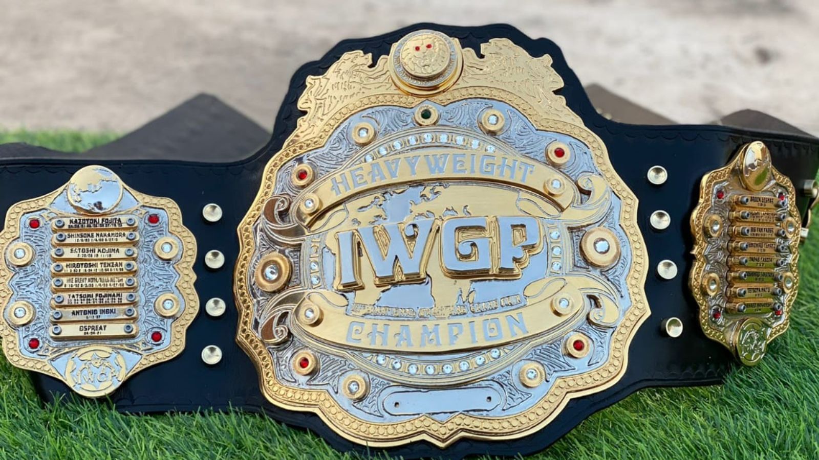 IWGP Heavyweight Championship (third design, 2008–2021) first claimed by Hiroshi Tanahashi - lion-crowned gold plates on black strap epitomize NJPW excellence. 