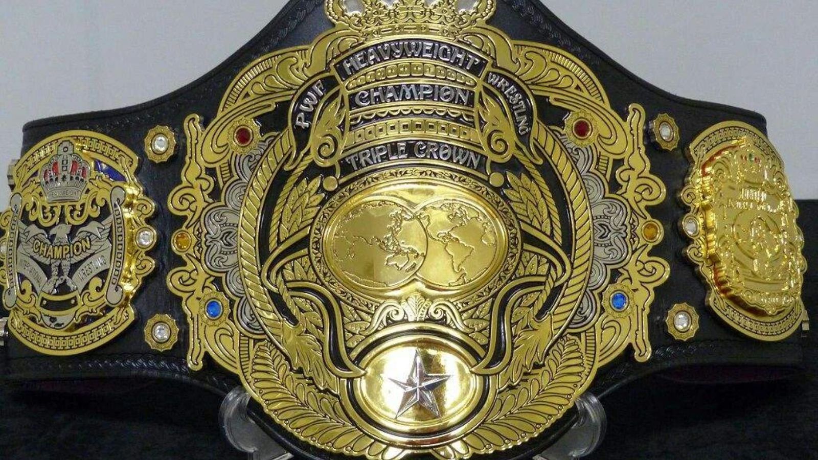 AJPW Triple Crown Heavyweight Championship, unveiled in 2013 for Suwama, fuses PWF, NWA United National, and NWA International titles into a single heritage-rich belt. 