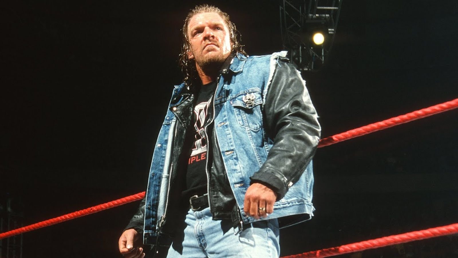  Triple H stands in the ring at Madison Square Garden as the roar of the crowd greets his return to Raw on January 7, 2002. 