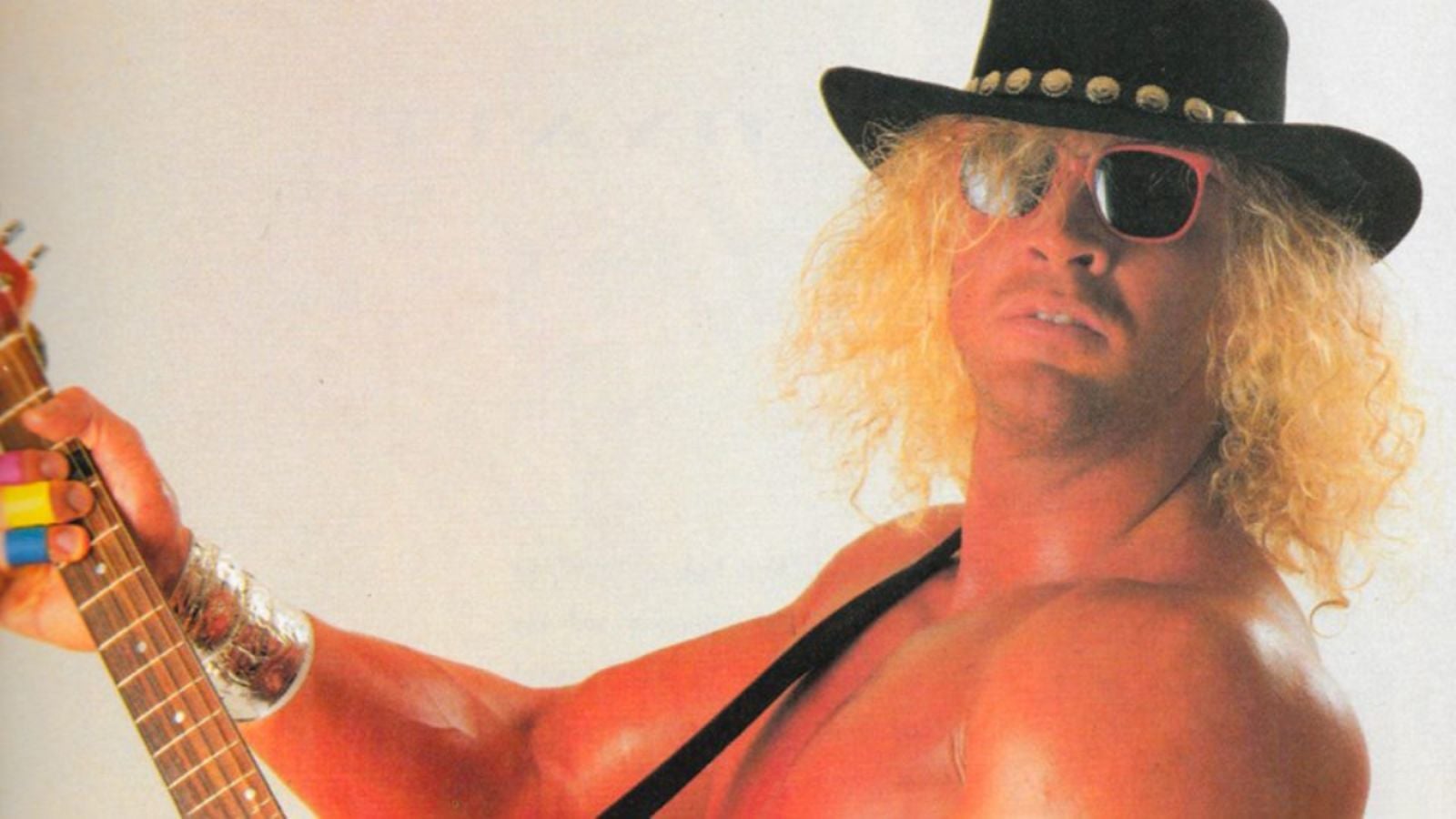 Early-1990s WCW star Van Hammer (Mark Hildreth) poses with his signature Flying V guitar and heavy metal persona.