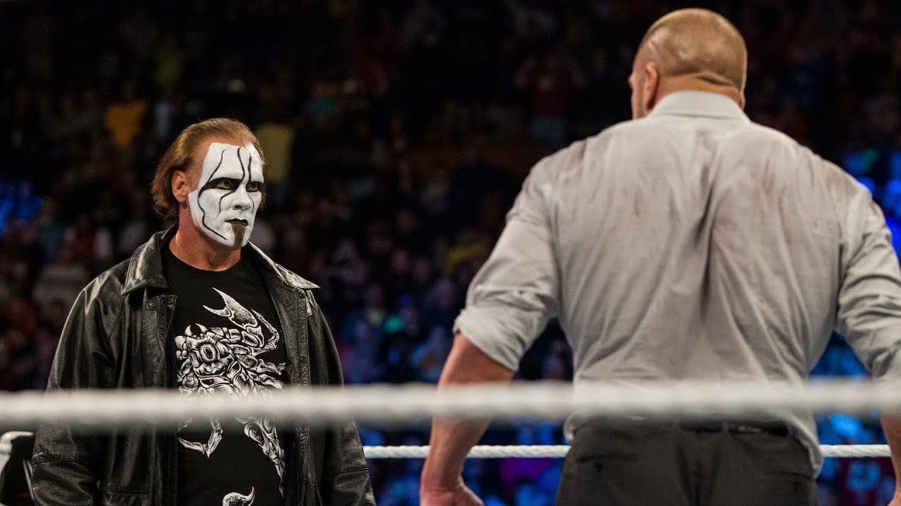 Sting stands across the ring from Triple H as he arrives in WWE for the very first time to assist Dolph Ziggler and Team Cena against The Authority at Survivor Series 2014 in Boston, Massachusetts on November 23, 2014.