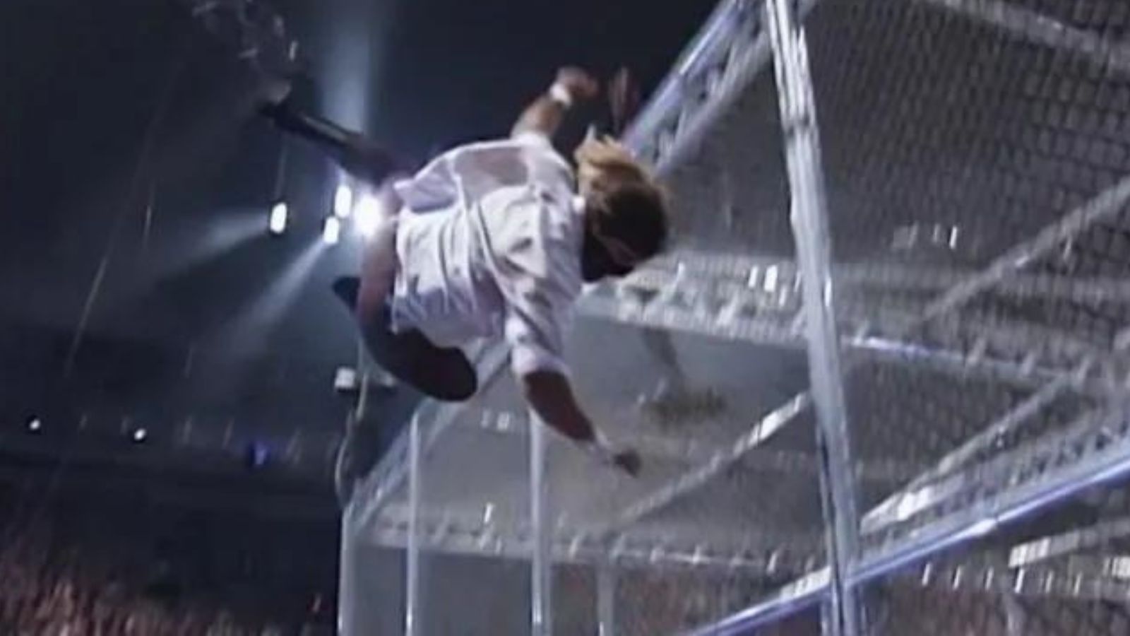 King of the Ring 1998: Mick Foley (Mankind) is hurled 16 feet from the top of Hell in a Cell by The Undertaker. Foley crashes through the Spanish announce table below, a moment forever etched in WWE history. 