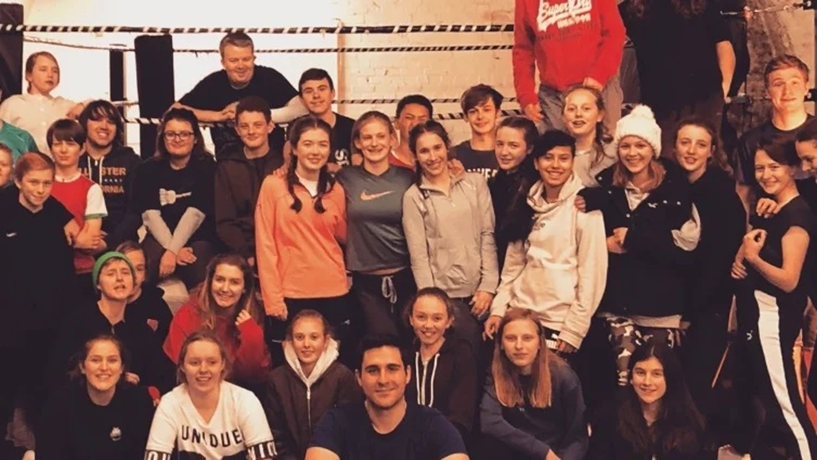 A class of aspiring pro wrestlers and referees in training.