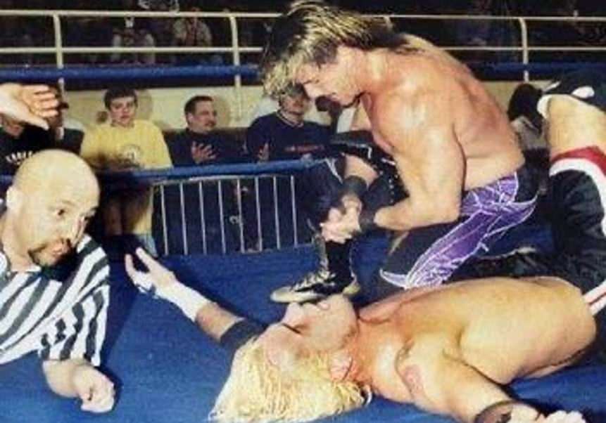 Eddie Guerrero showcases veteran ring psychology against rising indie star CM Punk during their transformative IWA Mid-South encounter that would shape Punk’s future WWE championship success.
