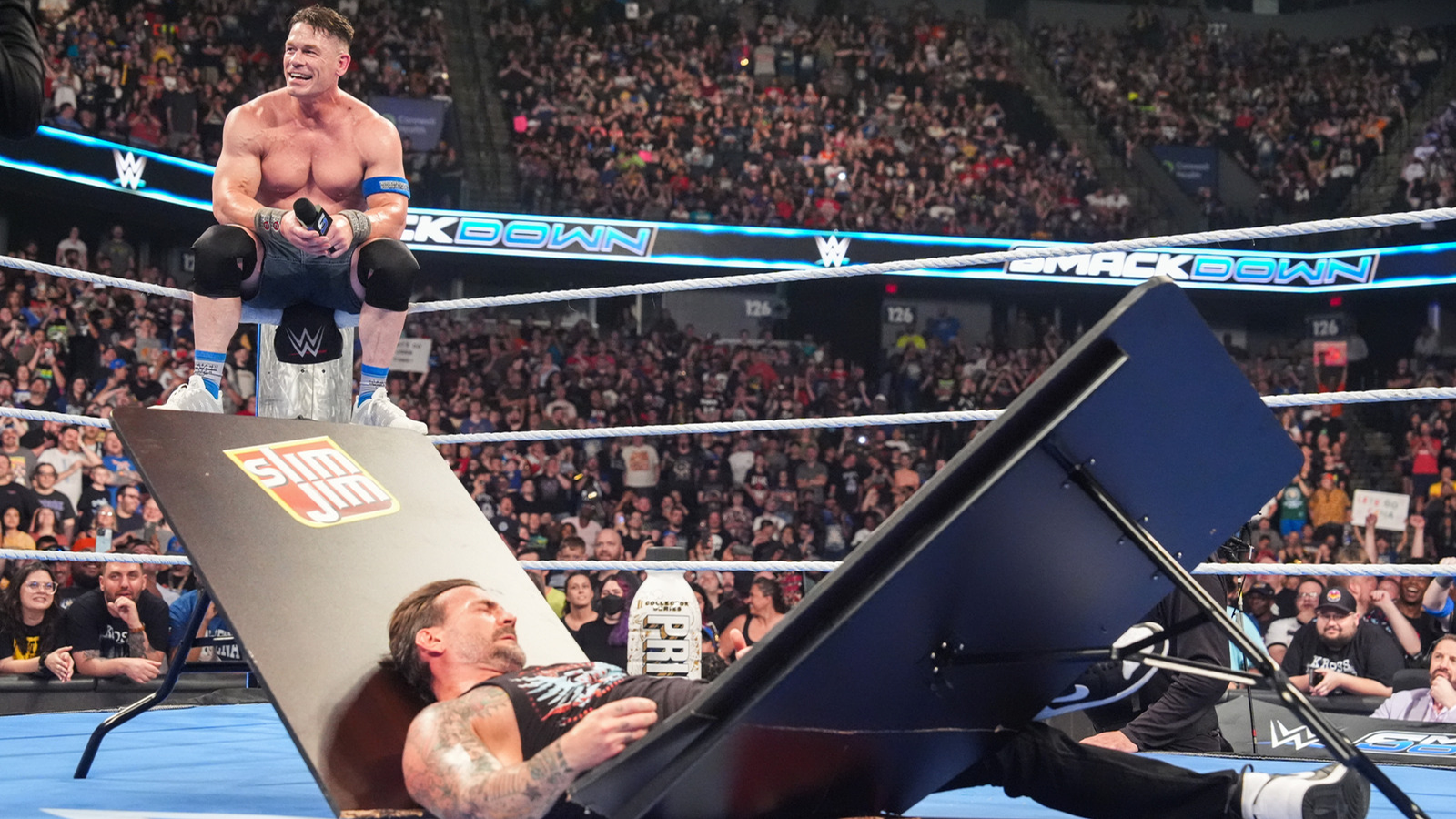 WWE SmackDown, June 27, 2025: John Cena spears CM Punk through a Slim Jim-branded ringside table. 
