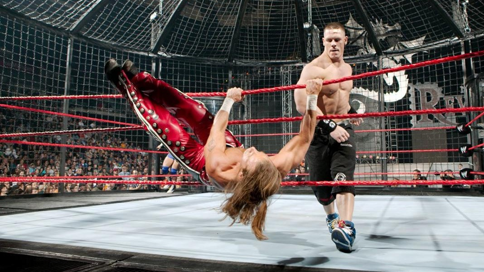 7 Elimination Chamber Moments That Broke WWE John Cena throws Shawn Michaels over the top rope during the Elimination Chamber match at New Year's Revolution 2006, moments before Edge would cash in his Money in the Bank contract.