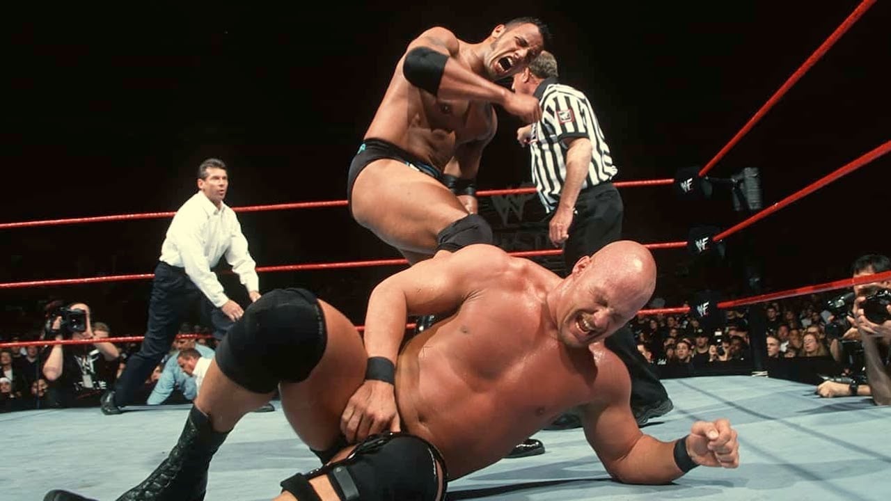 Stone Cold Steve Austin faces The Rock in their first WrestleMania main event on March 28, 1999, at WrestleMania XV in Philadelphia, Pennsylvania, with Mankind as special referee, in a WWE Championship match that cemented the Rock vs Stone Cold rivalry as a centerpiece of the Attitude Era. 