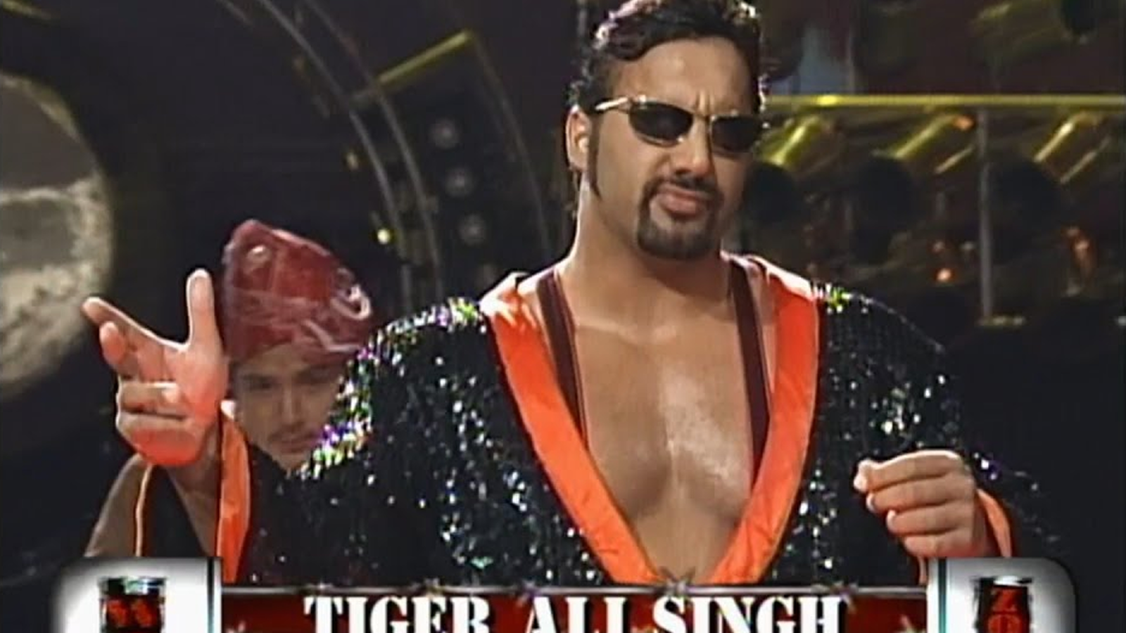 Tiger Ali Singh enters with manservant Babu during his controversial wealthy heir gimmick that failed to connect with Attitude Era WWE audiences.
