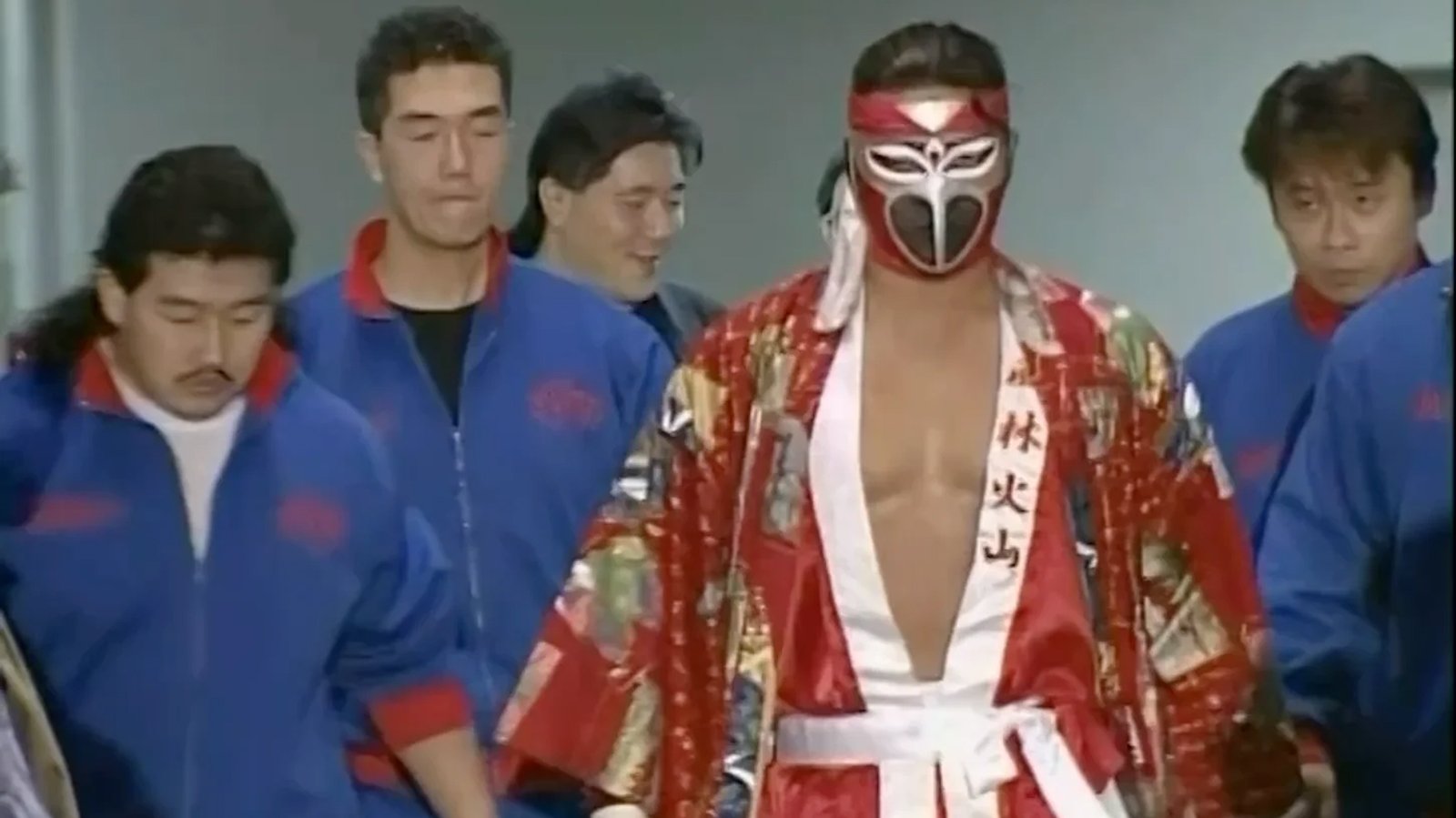 Eiji Ezaki as Hayabusa faces NJPW champion Jushin Liger at the 1994 Super J-Cup in Tokyo's Ryōgoku Kokugikan on April 16. This pivotal match between two high-flying innovators marked Hayabusa's breakthrough international performance and established him as a revolutionary force in aerial wrestling.