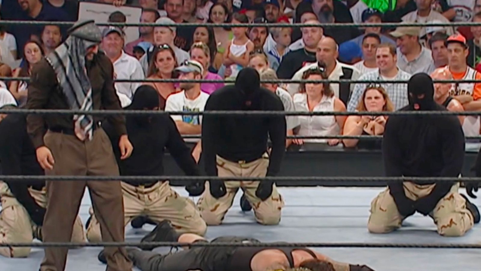 Muhammad Hassan stands over the Undertaker in a heat-building attack that was designed to lead to several PPV bouts between the two. Due to the controversy to follow, Hassan would be released and his potential never followed up on.