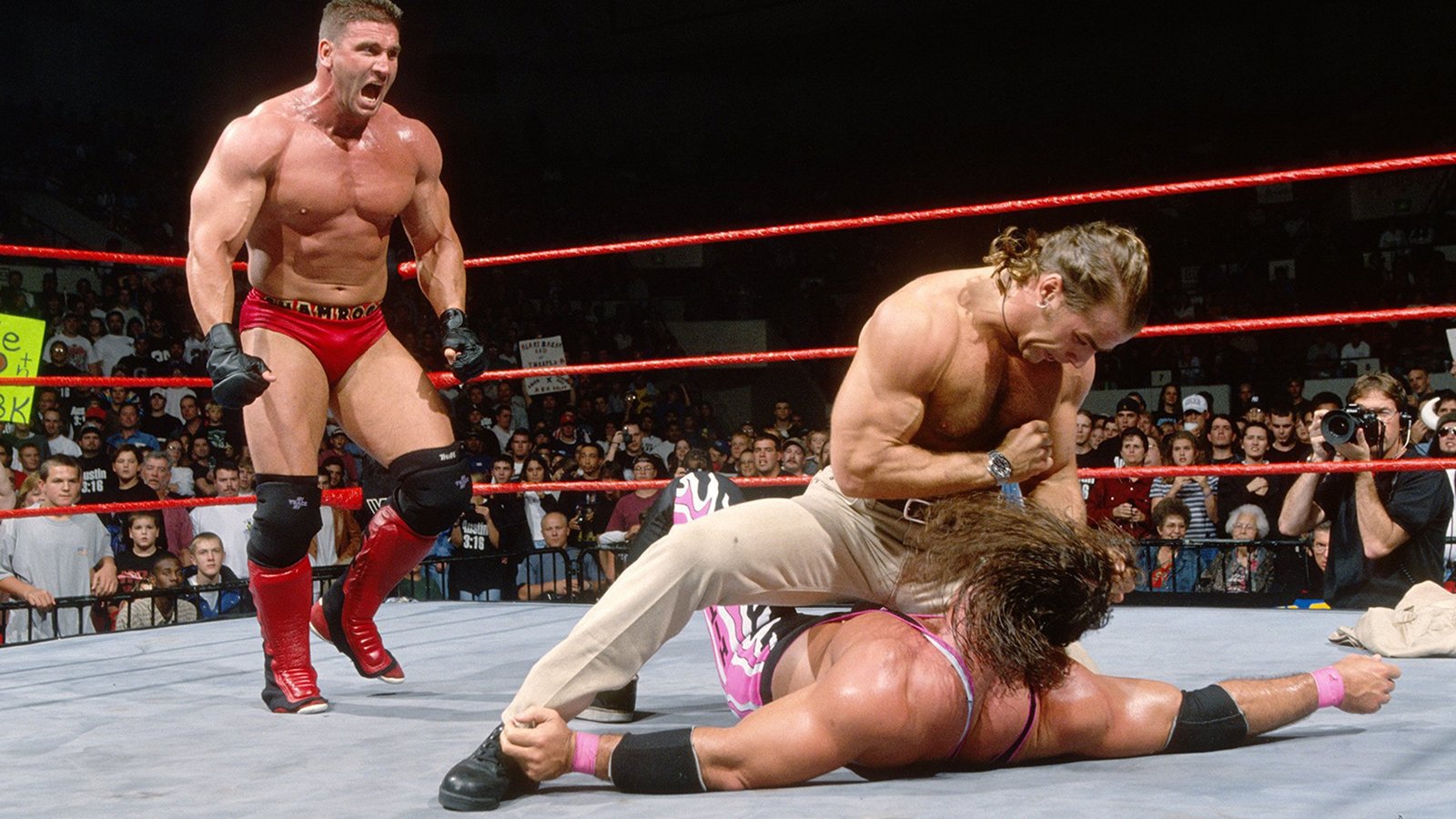 In late 1997, Ken Shamrock was involved in the main event title picture with Shawn Michaels, Bret Hart, and others, intervening here as Michaels gains the upper hand over Bret on an episode of WWF Raw is War.