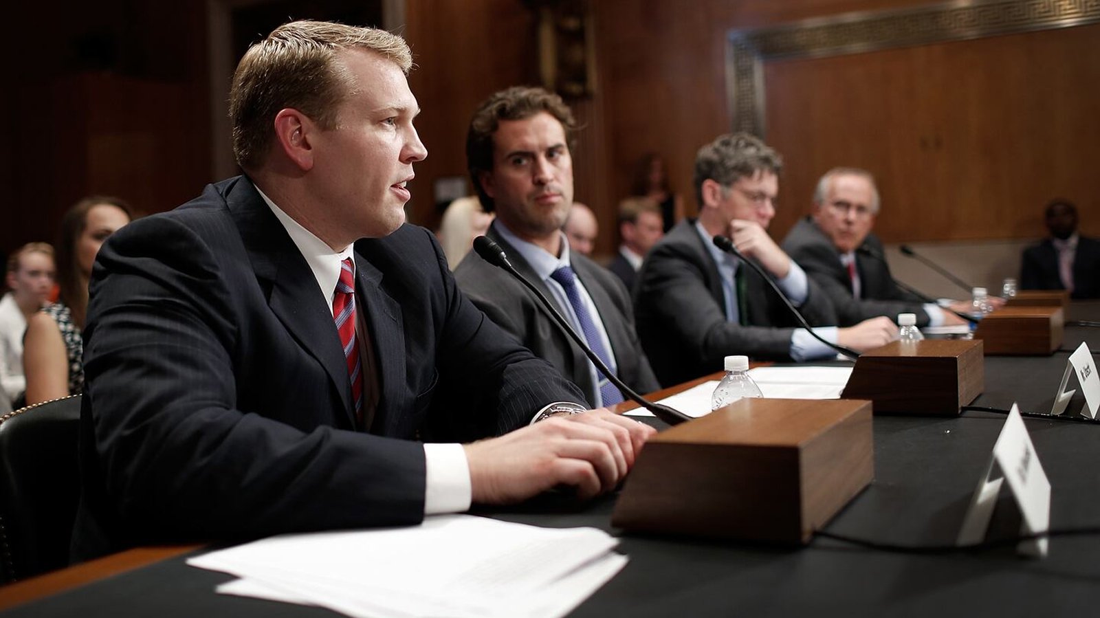In 2009, Christopher Nowinski testified before the U.S. Congress, delivering evidence-based testimony on Chronic Traumatic Encephalopathy (CTE) risks in contact sports and advocating for mandatory concussion removal protocols and independent medical oversight. The former WWE wrestler and Harvard graduate became the public face of sports brain injury prevention, establishing credibility as both a former athlete and emerging neuroscientist researching CTE at Boston University. His Congressional testimony helped shape policy reforms across the NFL, NHL, NCAA, and youth sports organizations. Photo Credit: The Boston Globe.