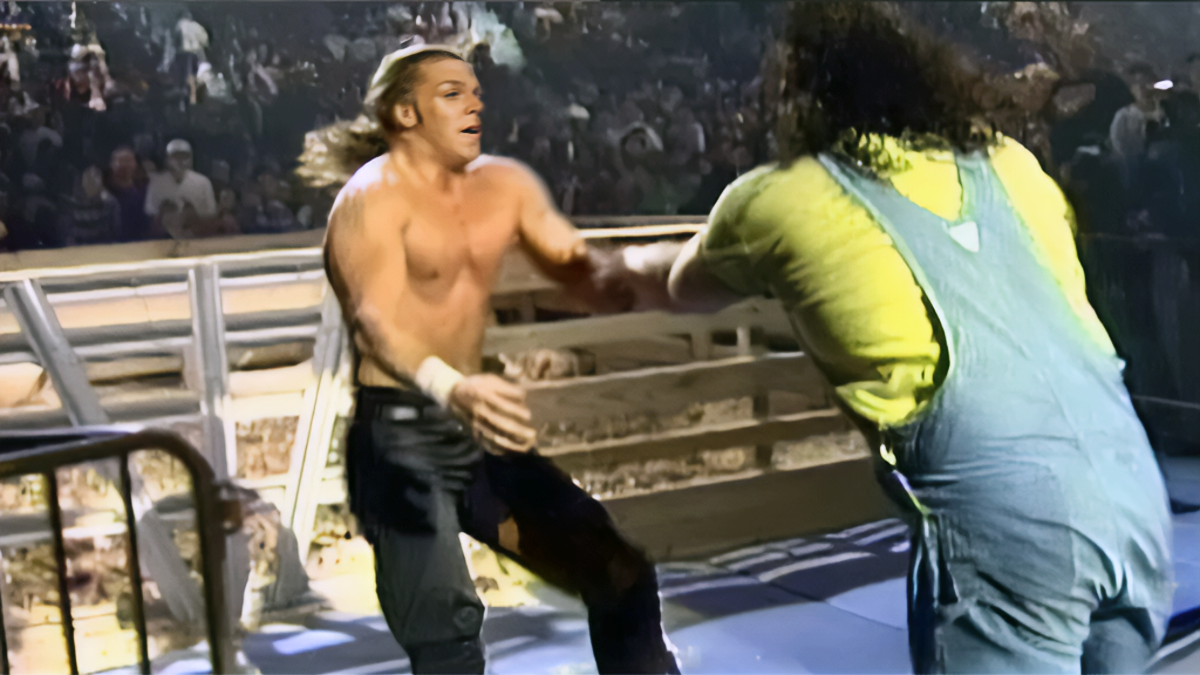 Hunter Hearst Helmsley (Triple H) battles Henry O. Godwinn during the Arkansas Hog Pen Match at In Your House 5. 