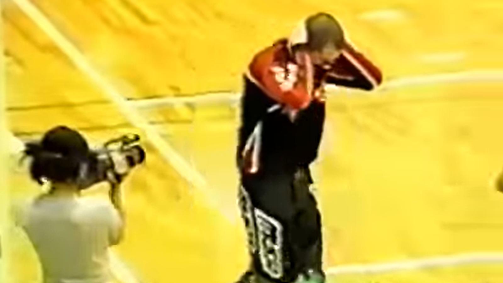 A battered Dirt Bike Kid leaves the ring holding his head in visible distress after enduring The Great Sasuke’s brutal assault. 