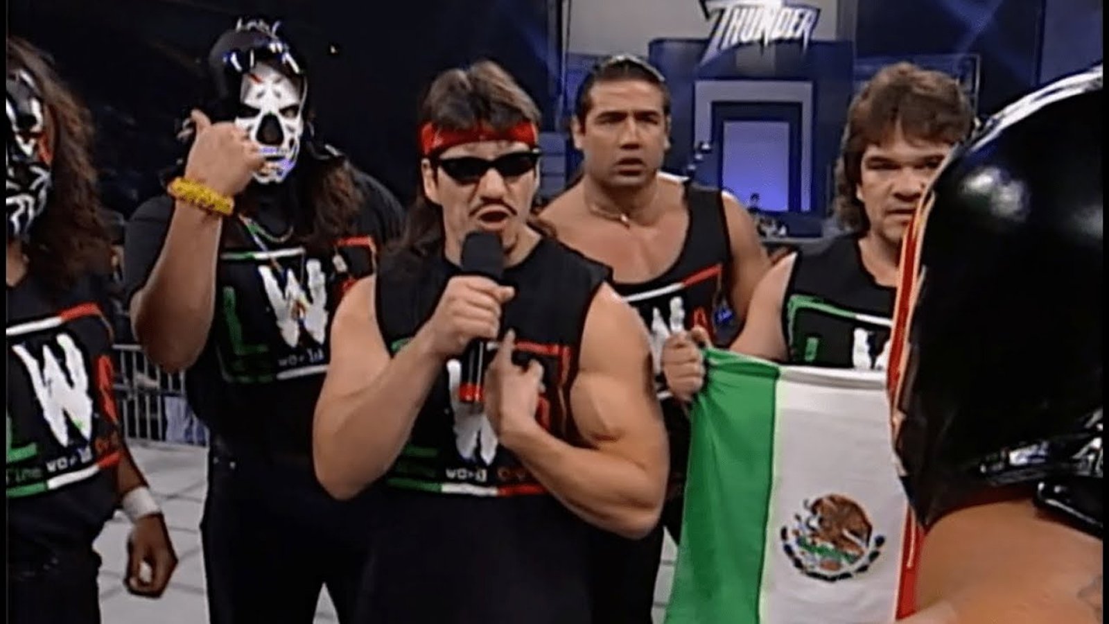 Eddie Guerrero recruits Rey Mysterio Jr. into the Latino World Order, which led to Mysterio’s later leadership roles in both the LWO and the Filthy Animals, WCW’s successor Latino wrestling factions. 