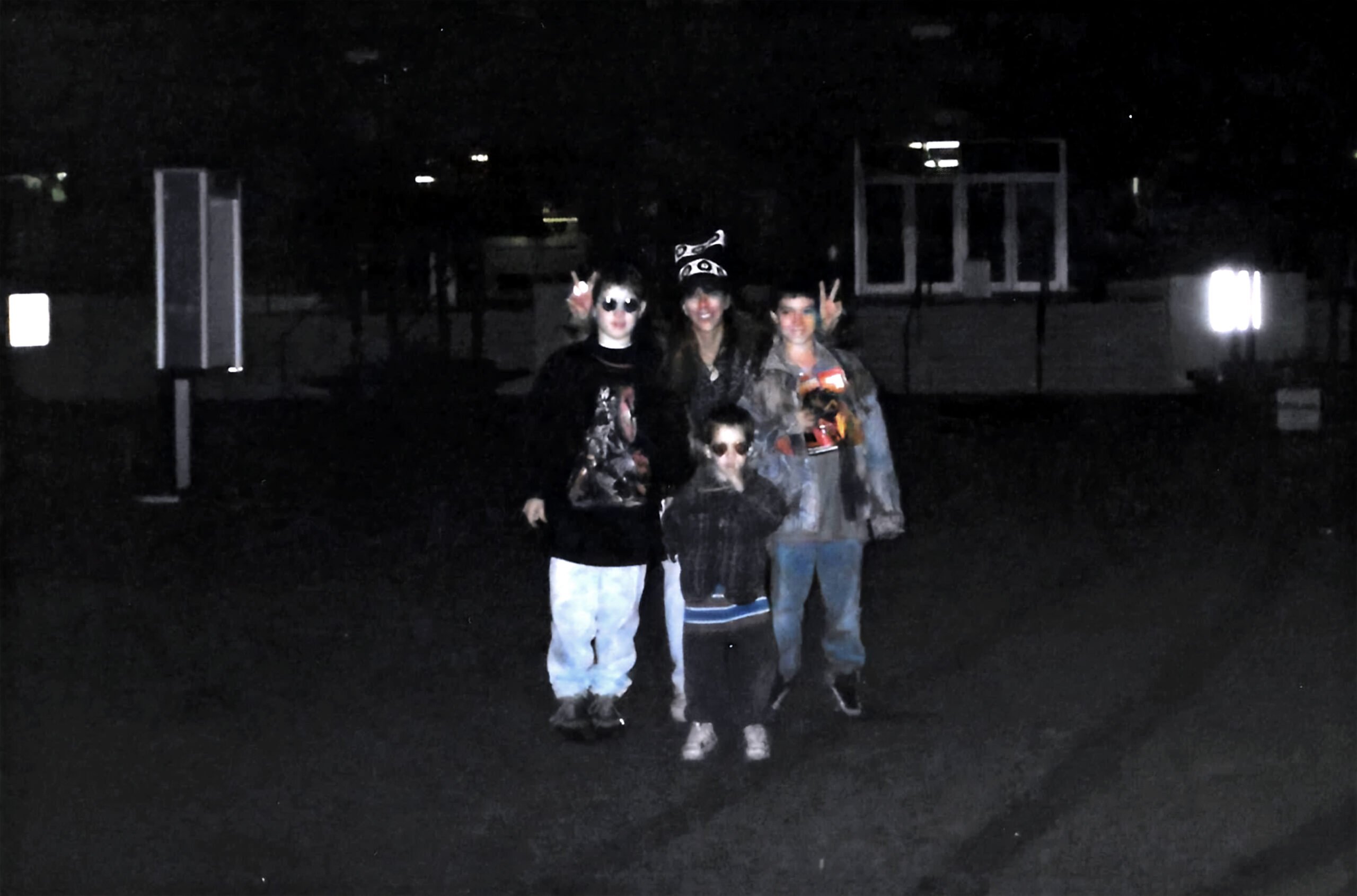Ryan Henslee with his mother and brothers standing outside Barton Coliseum following the 1997 WWE Little Rock riot