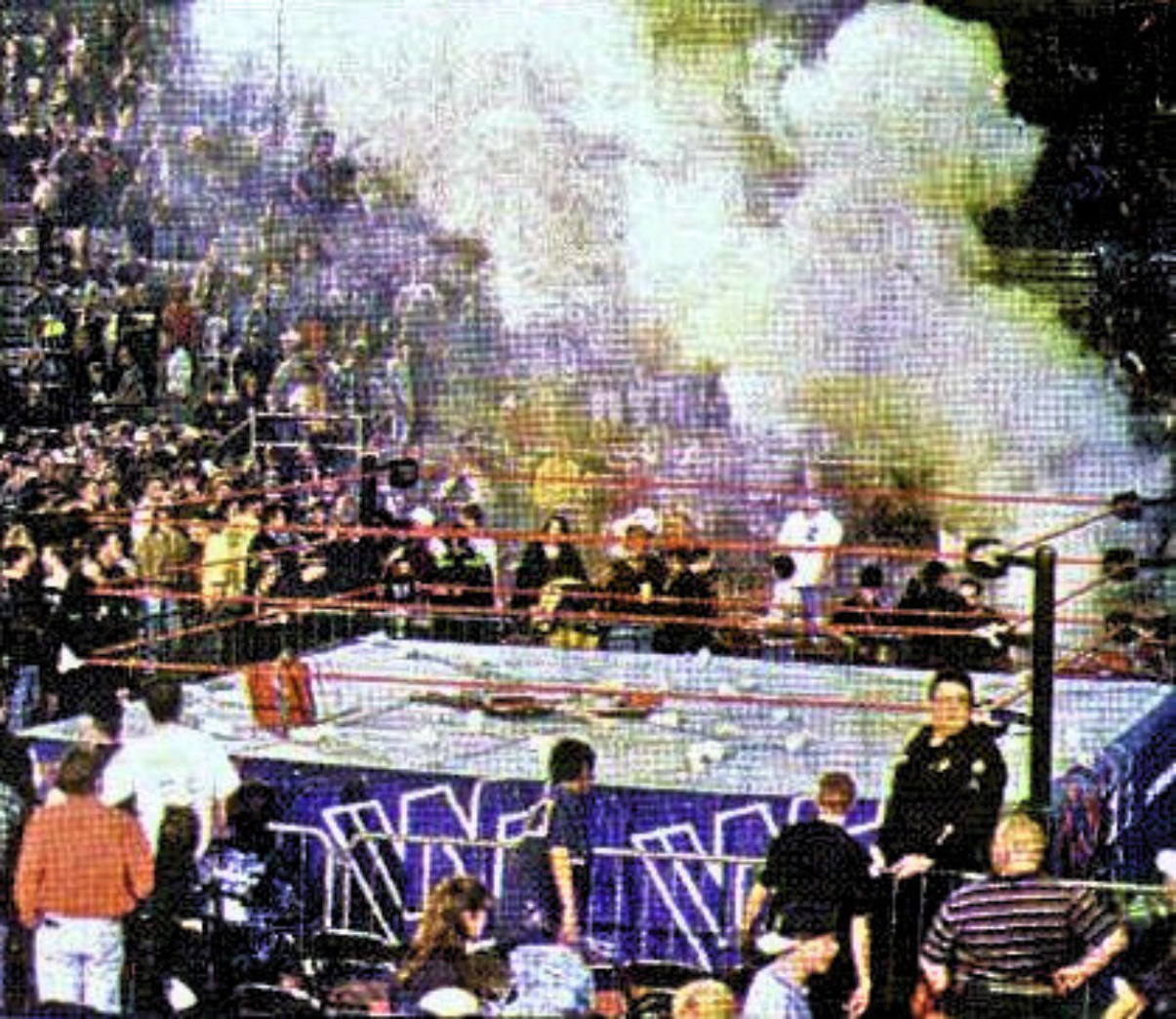 Never-before-seen photo showing aftermath of 1997 WWE riot at Little Rock Barton Coliseum with chairs and debris scattered