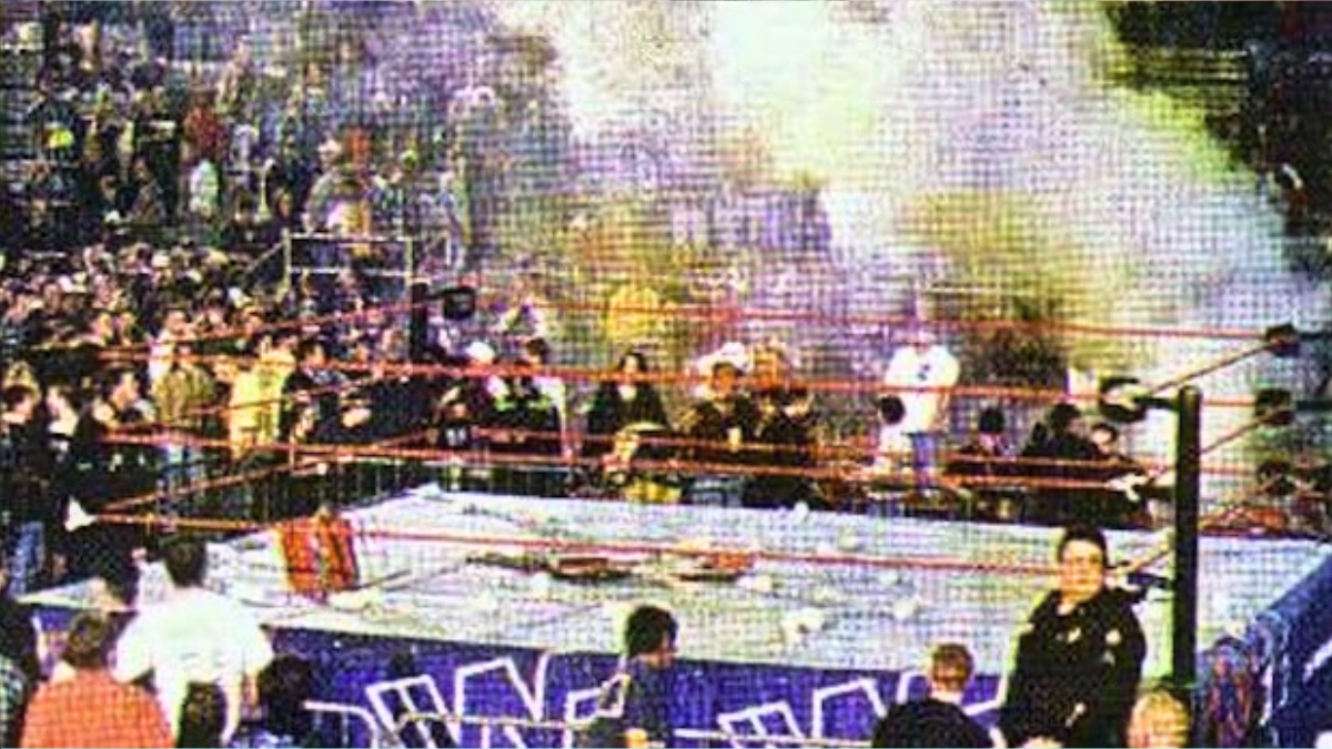 Never-before-seen photo showing aftermath of 1997 WWE riot at Little Rock Barton Coliseum with chairs and debris scattered