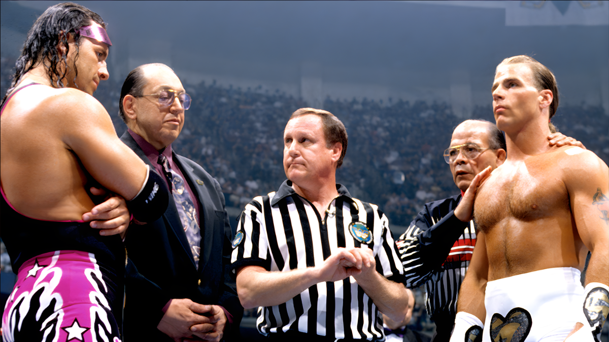 Earl Hebner stands between Bret Hart (with WWF President Gorilla Monsoon) and Shawn Michaels (with mentor and real-life trainer Jose Lothario, who came out of retirement for this match) at WrestleMania XII, poised to enforce Iron Man Match rules – and one missed call could rewrite wrestling history.