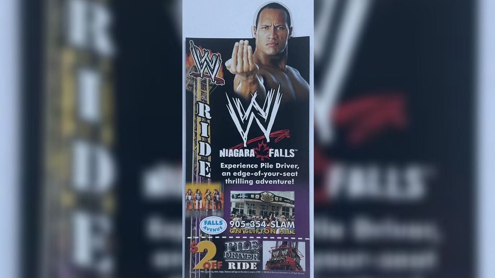 The Rock featured on an official WWE Niagara Falls promotional flyer inviting fans to the Pile Driver drop tower. 