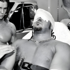 MNM members Melina and Johnny Nitro (John Morrison) attend to Joey Mercury during the Fatal 4-Way Ladder Match at WWE Armageddon December 17, 2006, after the ladder accident that resulted in Mercury's hospitalization and career-altering injury.