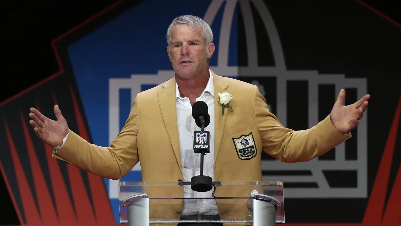 NFL quarterback Brett Favre, pictured here during his induction at the 2016 Pro Football Hall of Fame ceremony, became prominent in the Mississippi welfare scandal. Prosecutors have alleged that Favre received payments for speaking events he did not attend and was involved in arrangements in which TANF funds were directed to a volleyball facility at his alma mater, the University of Southern Mississippi. 