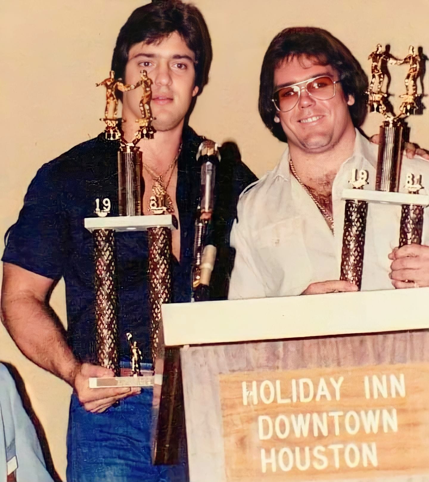 The Dynamic Duo, Gino Hernandez and Tully Blanchard, basking in their 1981 Tag Team of the Year accolades. The arrogant heels whose natural smugness and in-ring excellence made them the perfect villains for SWCW fans to hate, drawing money and main event crowds throughout the territory. 