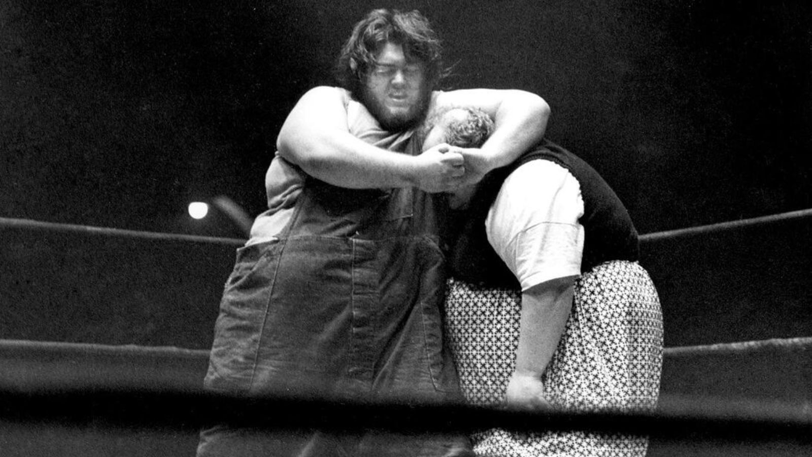 Happy Humphrey battles fellow super‑heavyweight Haystacks Calhoun in a featured matchup that united two of pro wrestling’s largest attractions at the turn of the 1960s, emphasizing the drawing power of early giant wrestlers. 