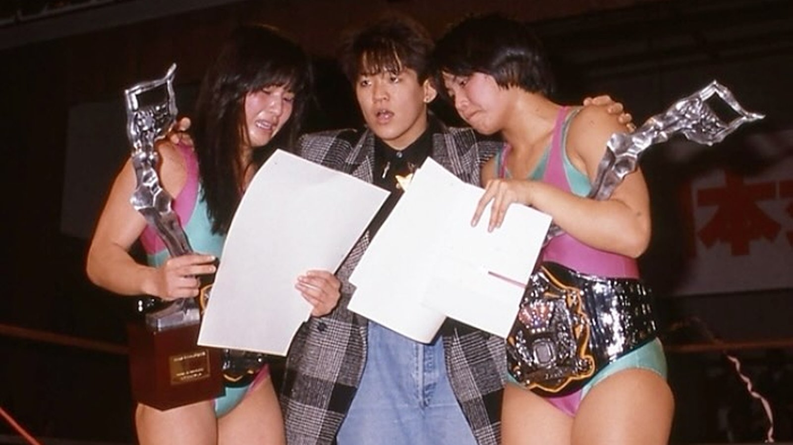 Chigusa Nagayo of the Crush Gals congratulates Itsuki Yamazaki and Noriyo Tateno after the Jumping Bomb Angels win the WWWA World Tag Team Championship in All Japan Women’s Pro Wrestling. 