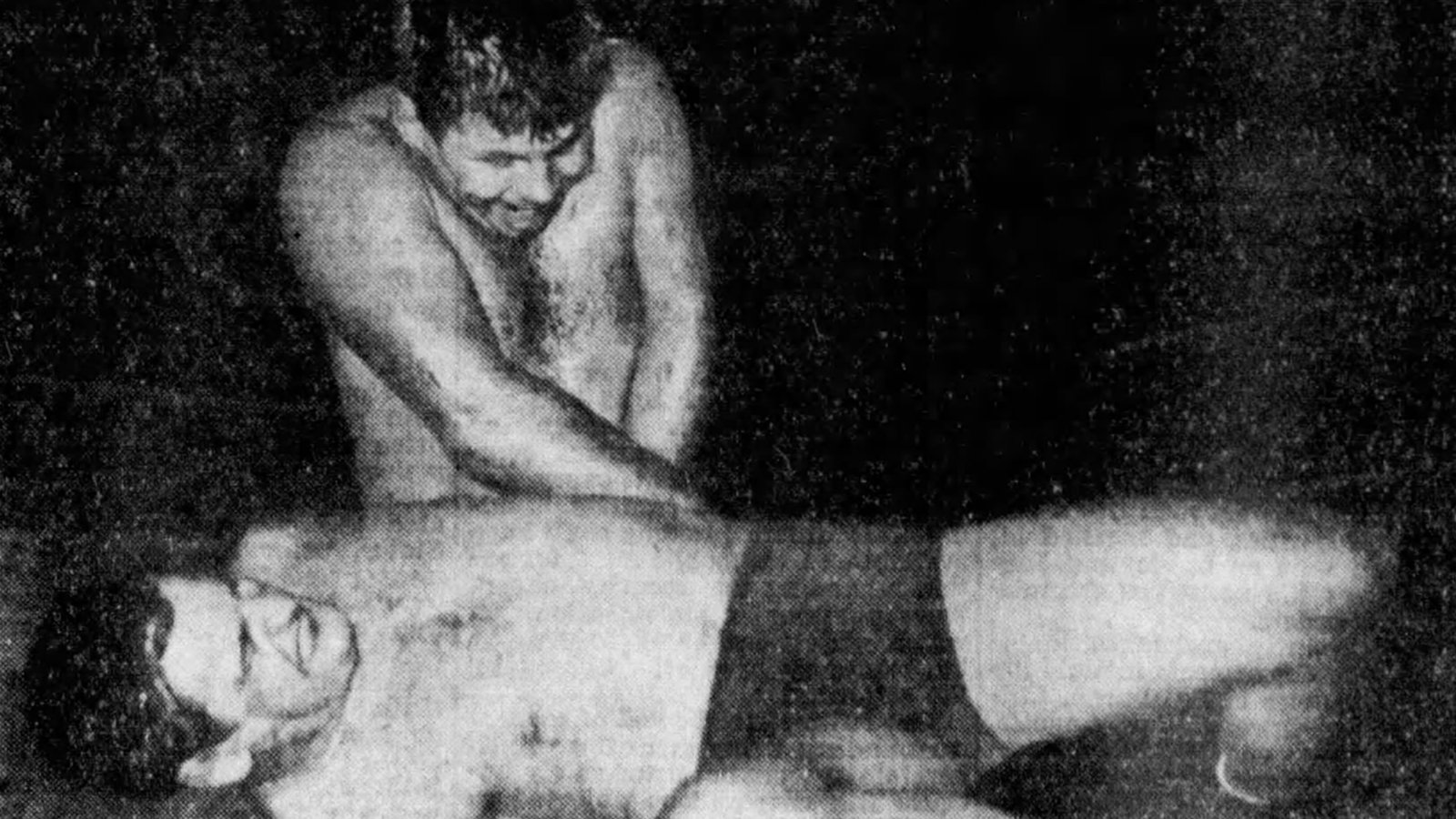 Ernie Dusek locks Ed Don George in a punishing hammerlock during their AWA World Heavyweight Title bout at the Buffalo Broadway Auditorium on August 30, 1934. After 71 minutes of a one-fall, ‘rough and exciting’ contest that thrilled 2,000 fans, Don George retained his title in a dramatic finish that had spectators on their feet.