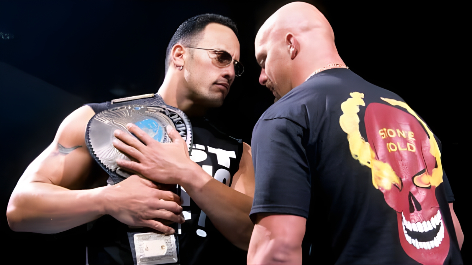 The Rock embraces the WWF Championship as Stone Cold Steve Austin stands ready to fight. They were rivals in the ring, but off camera, they were brothers who trusted each other to deliver 
