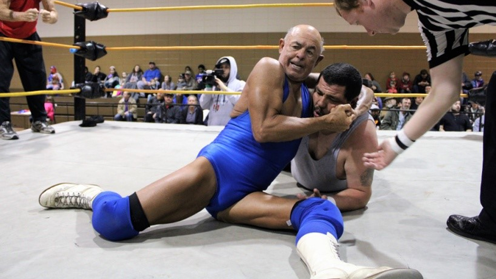 Action Mike Jackson applying a traditional headlock, displaying the technical fundamentals he honed across Southern wrestling territories. 