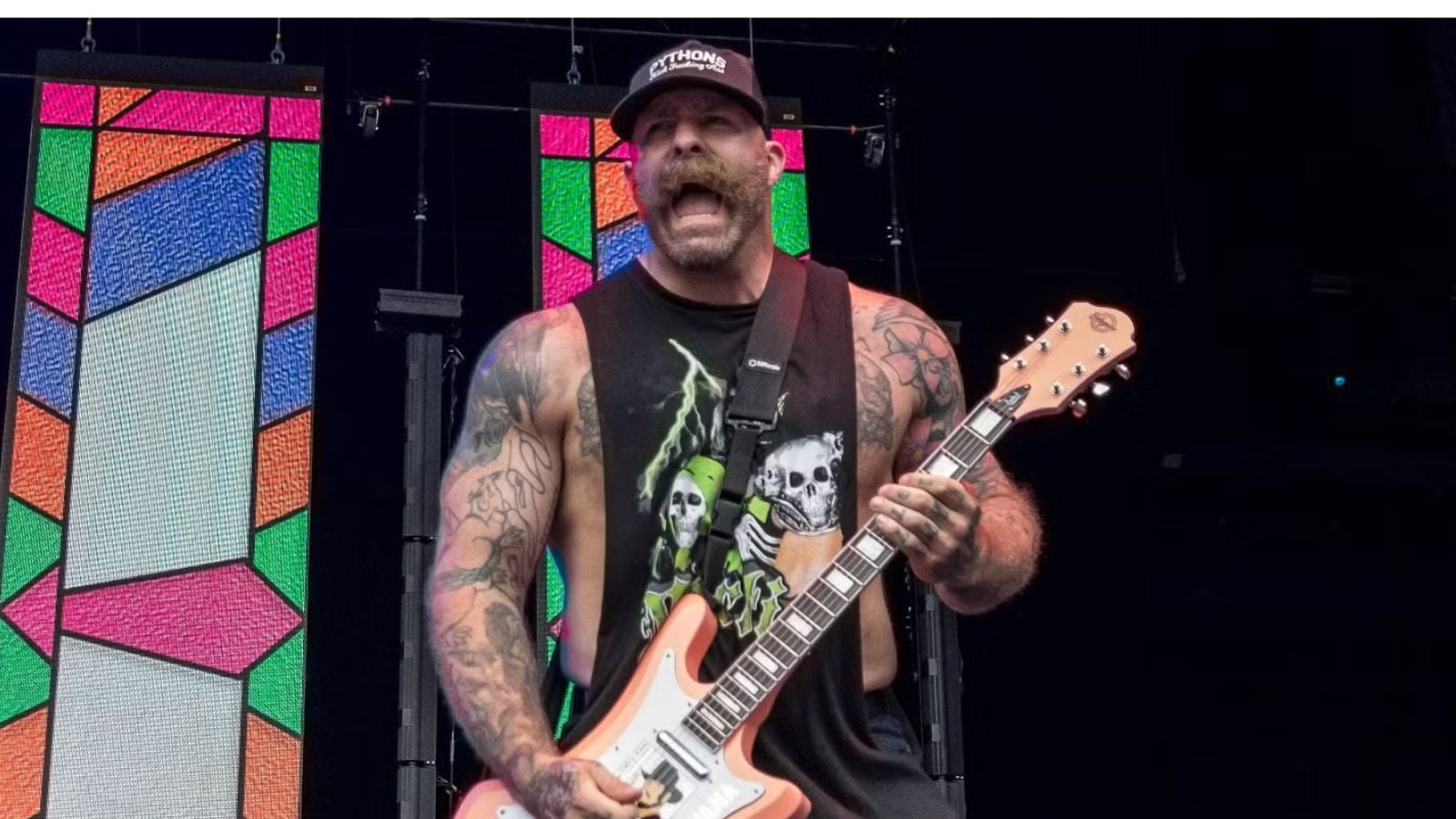 Andy Williams known in AEW as The Butcher performing with metalcore band Every Time I Die which he co-founded in 1998