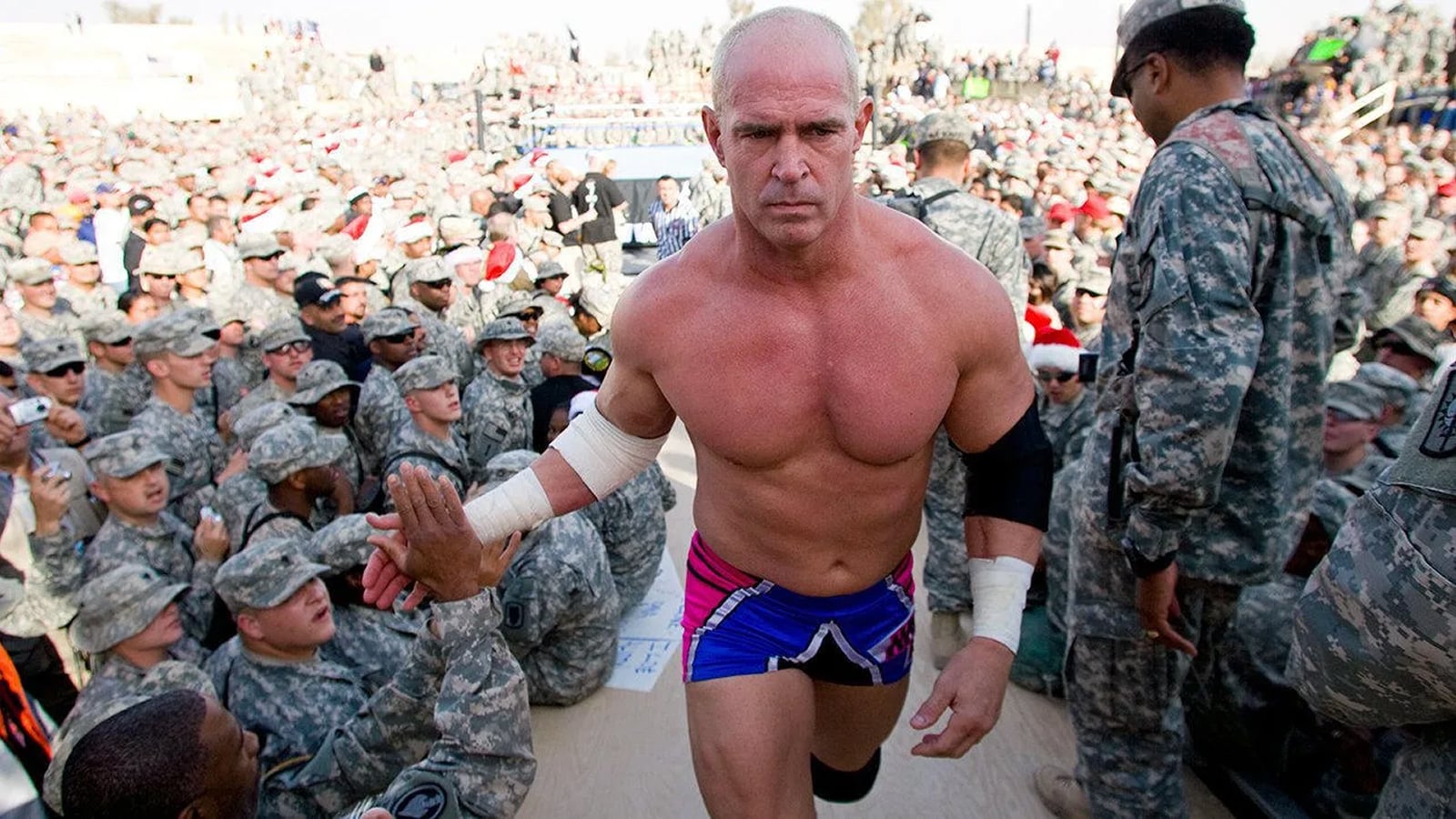 At the 2004 WWE Tribute to the Troops show taped on December 23, 2004 in Tikrit, Iraq, Hardcore Holly walks to the back after defeating Kenzo Suzuki in a singles match dedicated to the deployed servicemen and women.