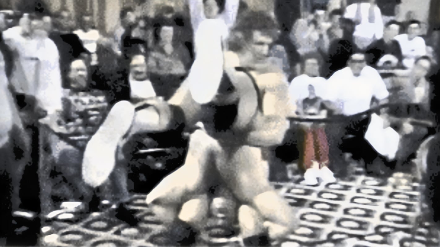 Bob Orton Jr. delivers a piledriver to B Brian Blair on the hotel carpet at the Penta Hotel in New York City during a UWF Fury Hour taping in early 1991. The unconventional setting became one of the most enduring images of how Herb Abrams ran his promotion.