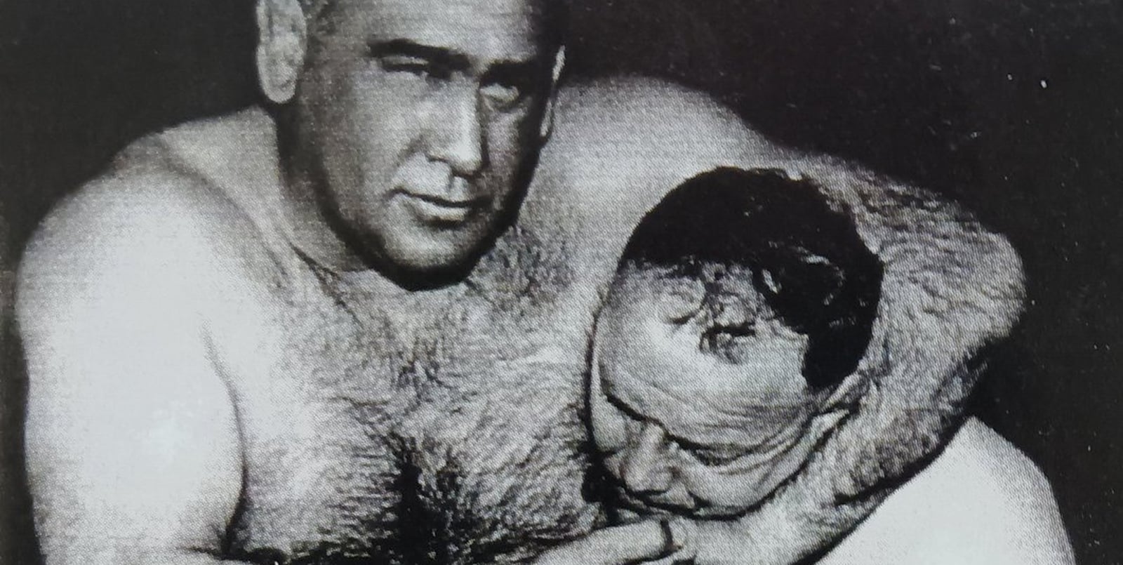 Ed "Strangler" Lewis, four-time World Heavyweight Champion, dominated with his feared headlock after mastering it on a custom railroad-spring wooden dummy machine.