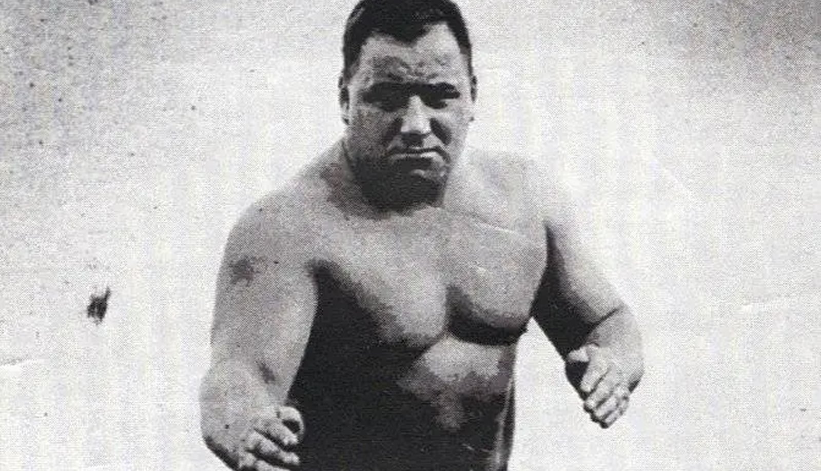 Bert Assirati, the compact English powerhouse and former acrobat turned legitimate strength phenom, dominated British, Empire, and European heavyweight wrestling for over two decades with his smothering power style.