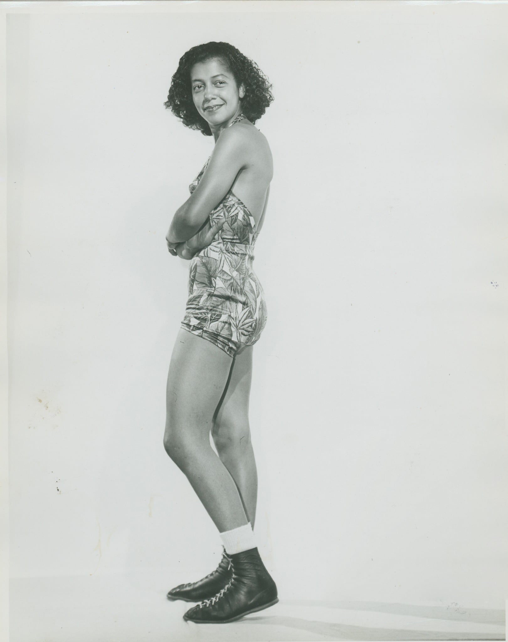 Barbara Ryan, identified on her vintage photograph as hailing from Seattle, Washington, appears in a set of early-1960s studio portraits of Black women wrestlers. 