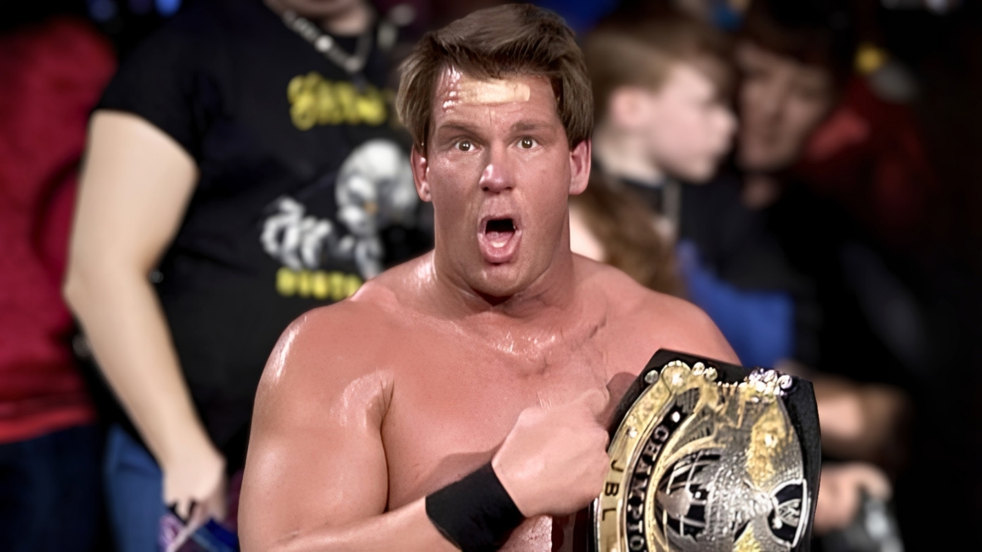 JBL (John Bradshaw Layfield) points to his WWE Championship during his run on top in 2004 and 2005, the image of a man who carried that same defiant, untouchable attitude from the ring straight into the locker room. 