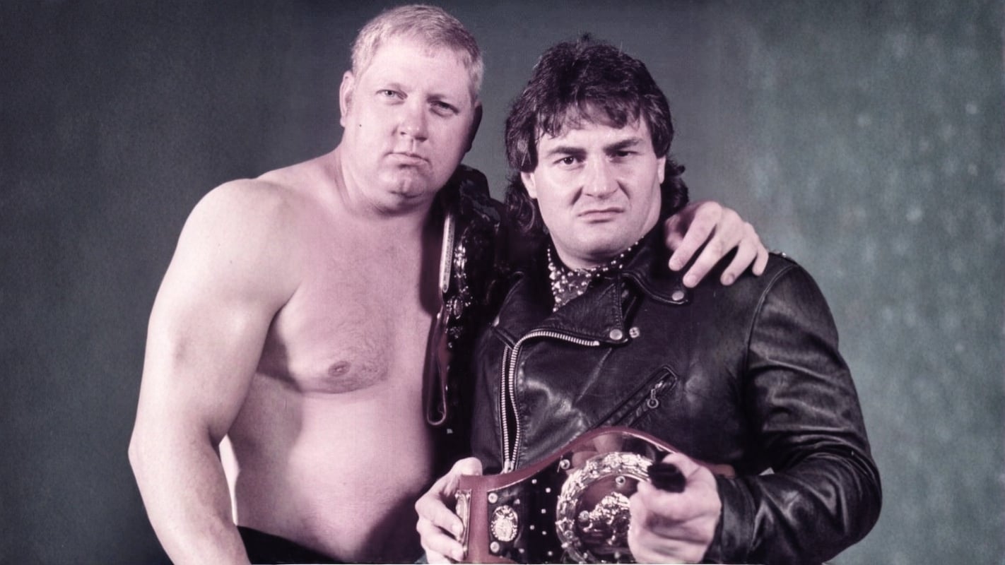Dick Murdoch and Adrian Adonis, The North-South Connection, were WWF World Tag Team Champions in 1984, combining rugged brawling with comedic chemistry. 