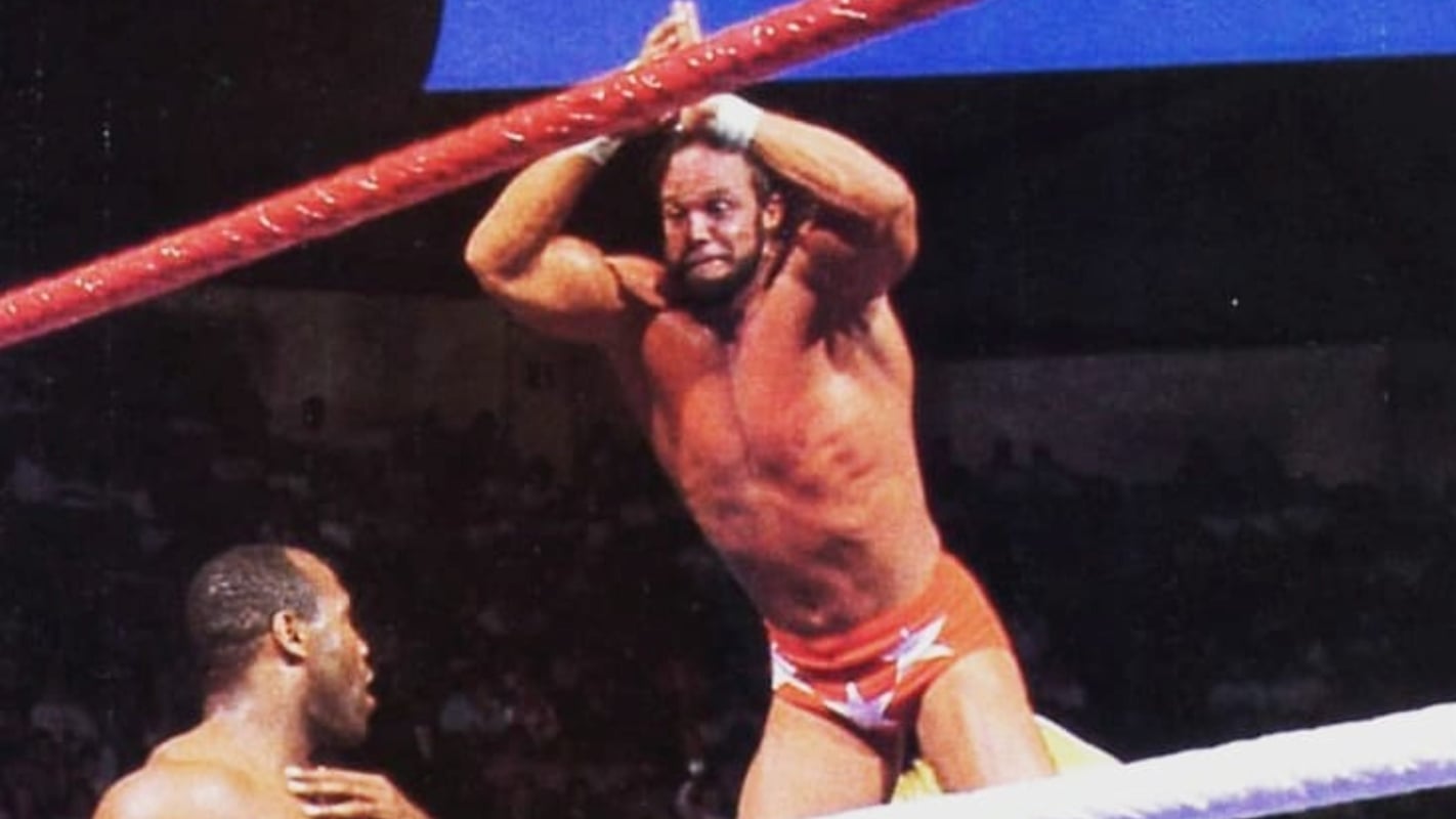 Macho Man Randy Savage delivers a double axe handle smash from the top rope, turning height, timing, and blunt force into one of pro wrestling’s nostalgic aerial attacks. Before dives became more complex, this was enough to make a crowd rise. It is one of the 150 classic wrestling moves you rarely see anymore. 