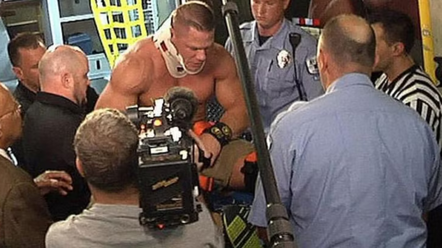 John Cena's Real Fight: 8 Injuries That Almost Ended Him John Cena recovering backstage after herniated disc surgery on his neck in 2008
